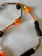 Load image into Gallery viewer, Phone Charm Orange &amp; Black Smiley Faces
